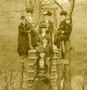 People posing with bridges